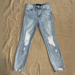 RISEN distressed light wash skinny jean with raw hem. Size 7/28” waist